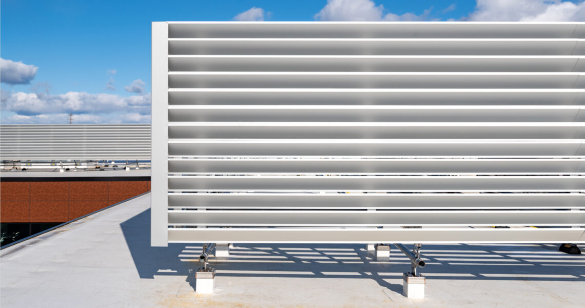 Anodized L10 louvers on top of modern commercial roof top to screen HVAC equipment
