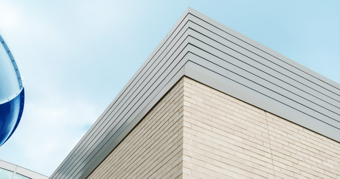 slatted architectural louvers on building roofline