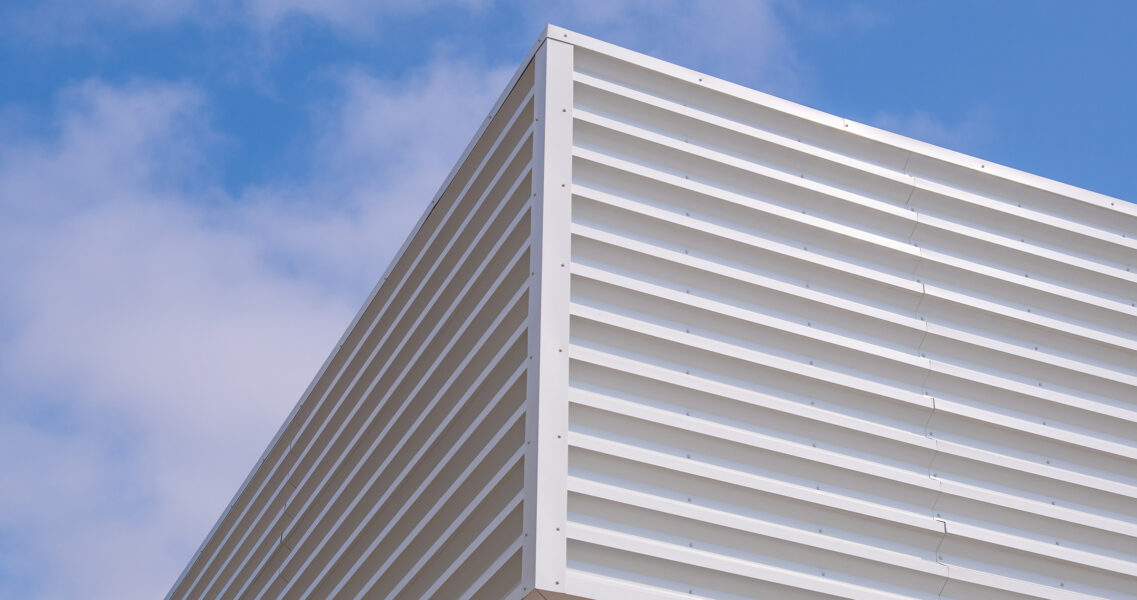 White ribbed equipment screen cladding